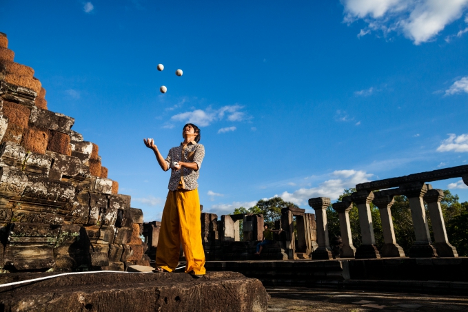 Viban juggling outside of the temples of Angkor Wat in Siem Reap, Cambodia. Viban is one of the star performers in "The Adventure", a Phare Circus show.